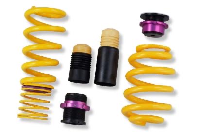 2 yellow vehicle suspension height adjustable springs and adjuster fittings