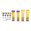 4 yellow vehicle suspension height adjustable springs with adjuster fittings attached, installation tool and fittings
