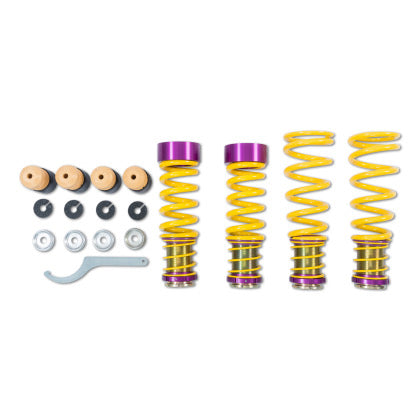 4 yellow vehicle suspension height adjustable springs with adjuster fittings attached, installation tool and fittings