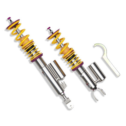 2 vehicle suspension chrome body coilovers with yellow springs and purple fittings, 1 coilover adjustment tool.