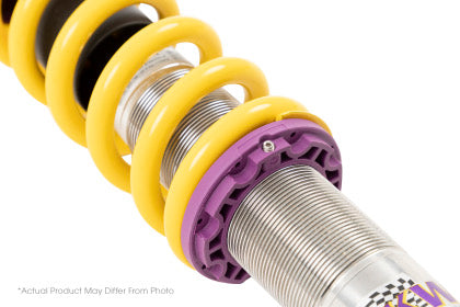 Chrome vehicle suspension coilover with yellow spring and close up of adjustable spring perch.