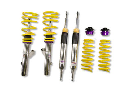 2 vehicle suspension chrome coilovers with yelow springs and purple accented fittings, 2 chrome coilovers, 2 yellow springs with 2 purple and black fittings.