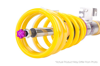 Close up of end of coilover and spring showing purple rebound adjustment knob.
