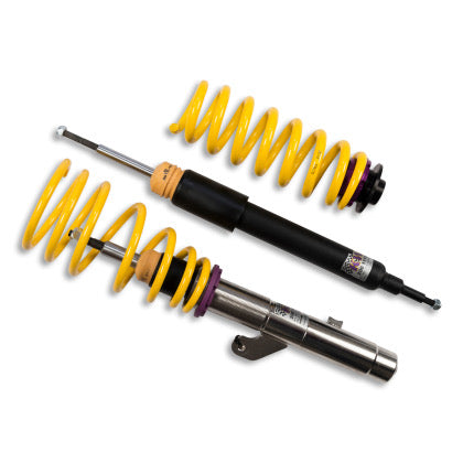 1 vehicle chrome coilover with yellow spring and 1 black coilover body with yellow spring and end fitting installed.