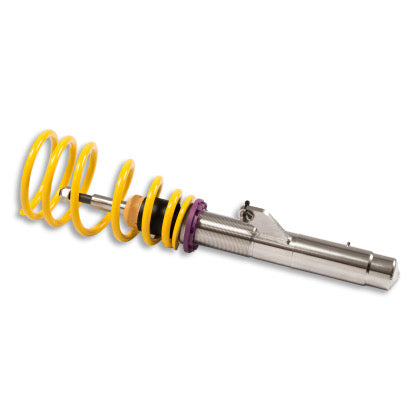 1 chrome vehicle suspension coilover with yellow spring.