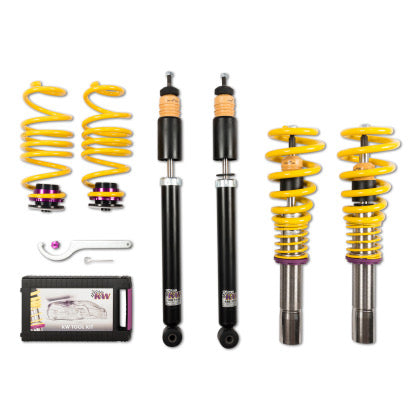 2 vehicle suspension chrome coilovers with yellow springs and purple accented fittings, 2 black body coilovers, 2 yellow springs with purple accented fittings, 1 coilover adjustment tool and storage box.
