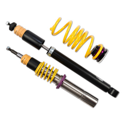 1 vehicle suspension chrome coilover with yellow spring and purple accented dfitting, 1 black body coilover and 1 yellow spring with purple accented fitting.
