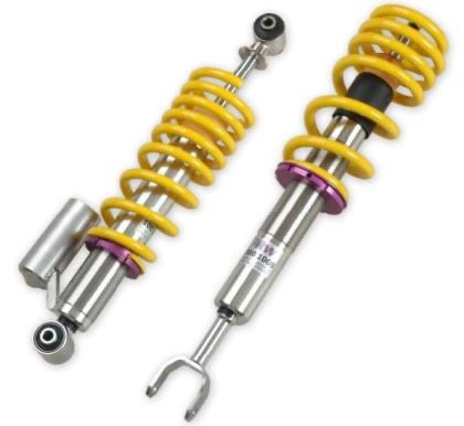 2 assembled vehicle suspension chrome body coilovers with yellow springs and purple accented fittings.