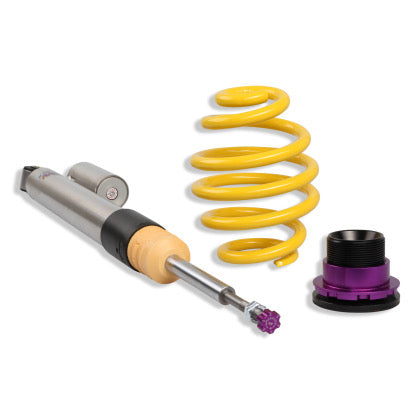 1 chrome body coilover and 1 yellow spring along with 1 black and purple fitting.