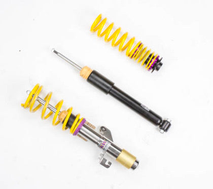 1 assembled vehicle suspension chrome coilover with yellow spring, 1 black coilover body and 1 yellow spring.