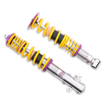 2 vehicle suspension chrome coilovers with yellow springs and purple fittings.