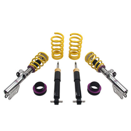 2 assembled vehicle suspension chrome coilovers with yellow springs, 2 black coilovers, 2 yellow springs and 2 purple adjustment fittings.