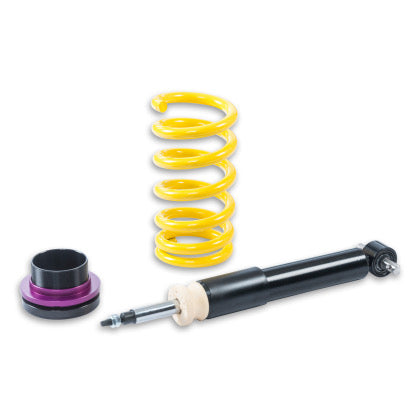 1 black boyd vehicle suspension coilover and 1 yellow spring with black and purple fitting.