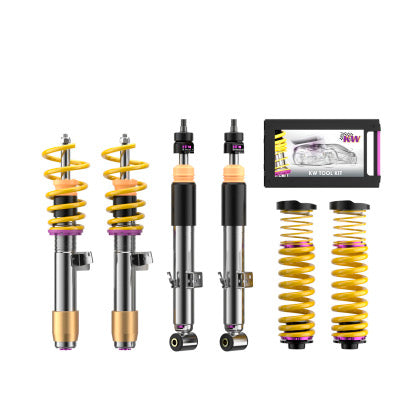 2 assembled vehicle suspension chrome body coilovers with yellow springs and purple accented fittings, 2 chrome body coilovers and 2 yellow springs, tool kit box.