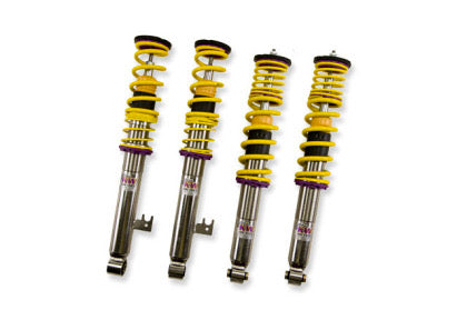4 chrome and yellow vehicle suspension coilovers