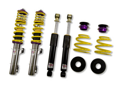 2 vehicle suspension chrome coilovers with yellow springs and purple accents, 2 black coilovers and 2 yellow springs with 2 purple accented fittings and 2 black fittings.