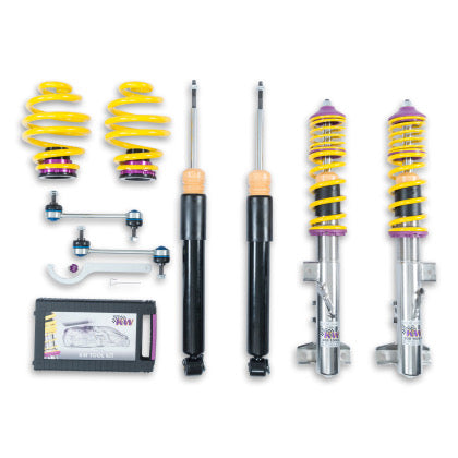 2 vehicle suspension chrome coilovers with yellow springs and purple fittings, 2 black coilover bodies and 2 yellow springs with purple end fittings along with end links and coilover adjustment tool and storage box.