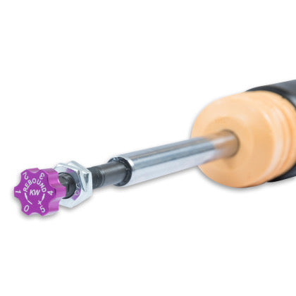 Close up of purple rebound adjustment knob at end of coilover.
