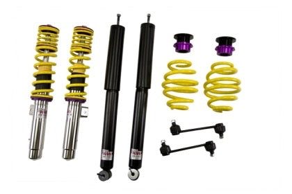 2 assembled vehicle suspension chrome coilovers with yellow springs, 2 black  coilovers and 2 yellow springs with end fittings and links