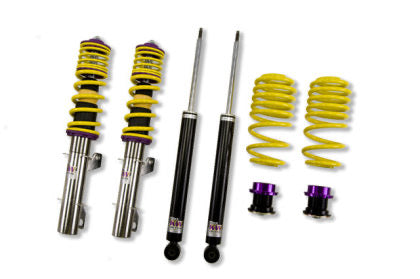 2 assembled vehicle suspension chrome body coilovers with yellow springs and purple accented fittings, 2 black body coilovers and 2 yellow springs with black and purple fittings.