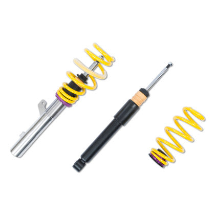 1 chrome vehicle suspension coilover with yellow spring, 1 black coilover and 1 yellow spring with purple end fitting.