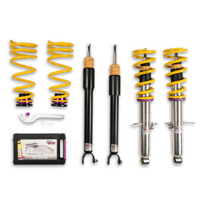 2 assembled vehicle suspension chrome coilovers with yellow springs, 2 black coilover bodies and 2 yellow springs with end fittings, 1 installation tool and storage box.