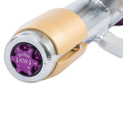Purple bump adjustment knob at end of chrome body coilover.
