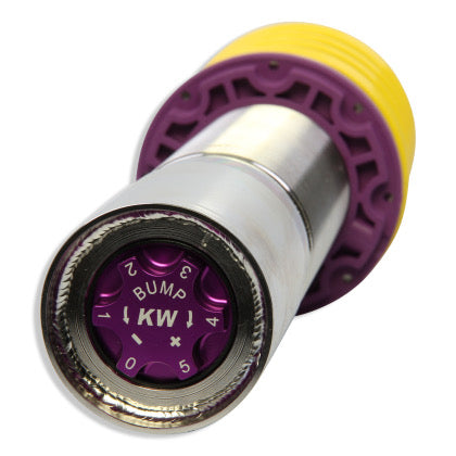 Close up view of purple bump adjustment knob on chrome body coilover with yellow spring.