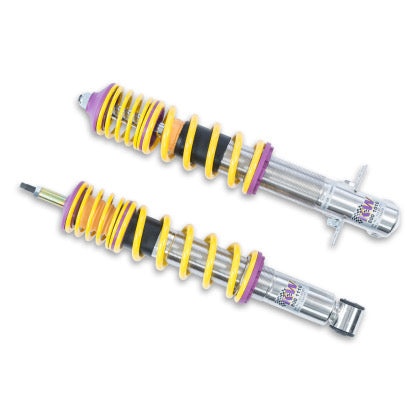 2 chrome body vehicle suspension coilovers with yellow springs and purple fittings.