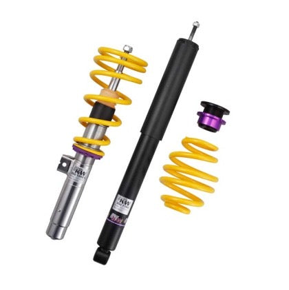 1 vehicle suspension chrome coilover with yellow spring and purple fitting, 1 black coilover and 1 yellow spring and 1 black and purple fitting.