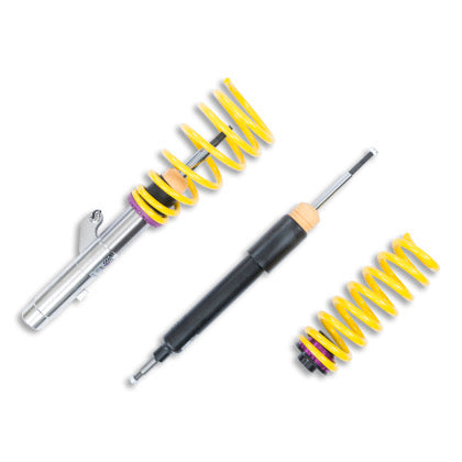 1 vehicle suspension chrome body coilover with yellow spring and purple accented fittings, 1 black body coilover and 1 yellow spring with purple end fitting.