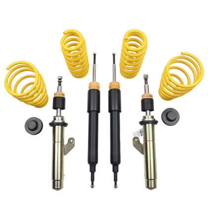 Suspension coilover kit showing two struts inside threaded sleeve, two black struts and 4 lowering springs