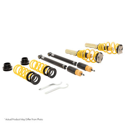 Vehicle adjustable coilover over kit with two assembled coilovers, two struts and two yellow springs