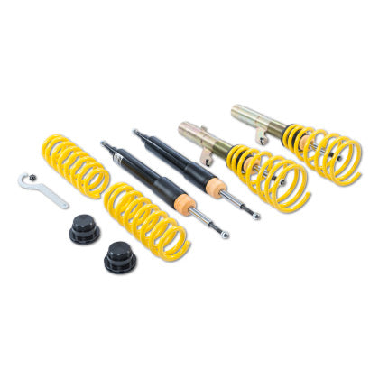 Vehicle suspension coilover kit with two assembled coilovers, two black struts and two yellow springs