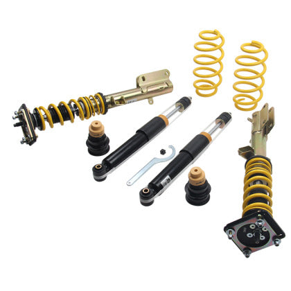 Two assembled vehicle suspension adjustable coilovers, two unsleeved black coilover struts and coilover springs