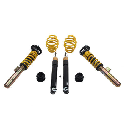 Adjustable coilover kit showing two assembled coilovers, two struts and two lowering springs
