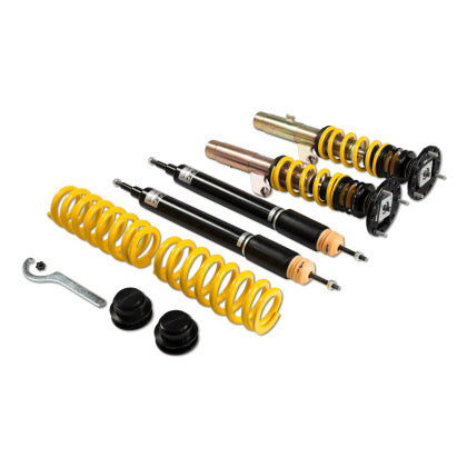 Suspension coilover kit with two assembled coilovers, two unassembled black coilover struts and two yellow springs