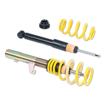 One vehicle suspension coilover, one unsleeved coilover blck strut and one yellow coilover spring