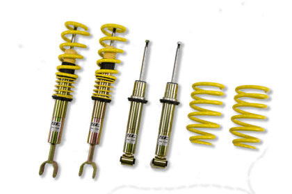 Two assembled vehicle suspension coilovers, two sleeved coiler struts and two yellow coilover springs