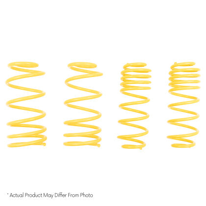 Four yellow vehicle lowering springs