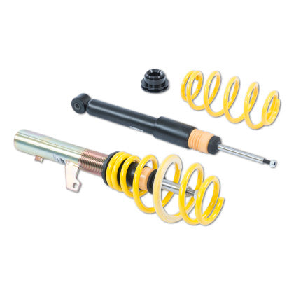 One assembled adjustable coilover, one unsleeved coilover black strut and one yellow coilover spring and end fitting