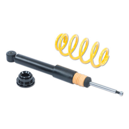One unsleeved coilover black strut with one yellow coilover spring and end fitting