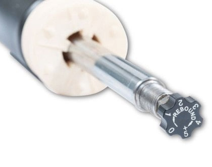 Rebound adjustment knob at the end of a coilover strut