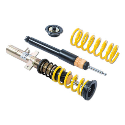 Assembled adjustable vehicle suspension coilover, single black unsleeved coilover strut and yellow coilover spring