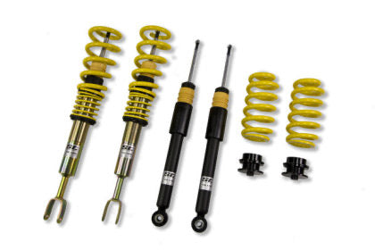 Two assembled vehicle coilovers, two black struts and two yellow lowering springs