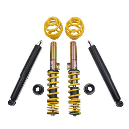 Two assembled vehicle suspension coilover overs and two black unsleeved struts and two yellow lowering springs