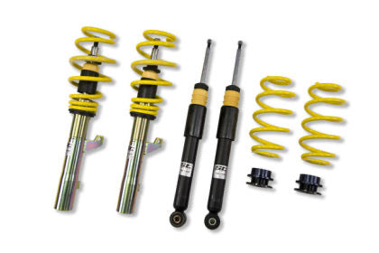 Veicle coilover kit with two assembled struts, two black unsleeved struts and two lowering springs in yellow