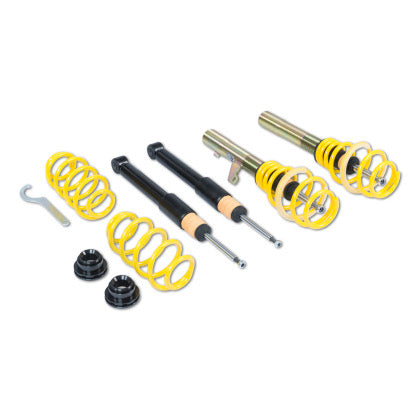 Assembled coilover struts along with two unsleeved struts and yellow lowering springs