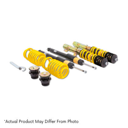 Two assembled vehicle suspension adjustable coilovers, two unsleeved coilover black struts and two yellow coilover springs with end fittings