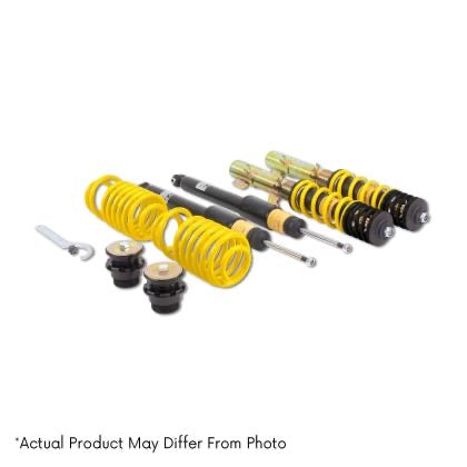 Two assembled vehicle suspension adjustable coilovers, two unsleeved black coilover struts and two yellow coilover springs with end fittings and tool